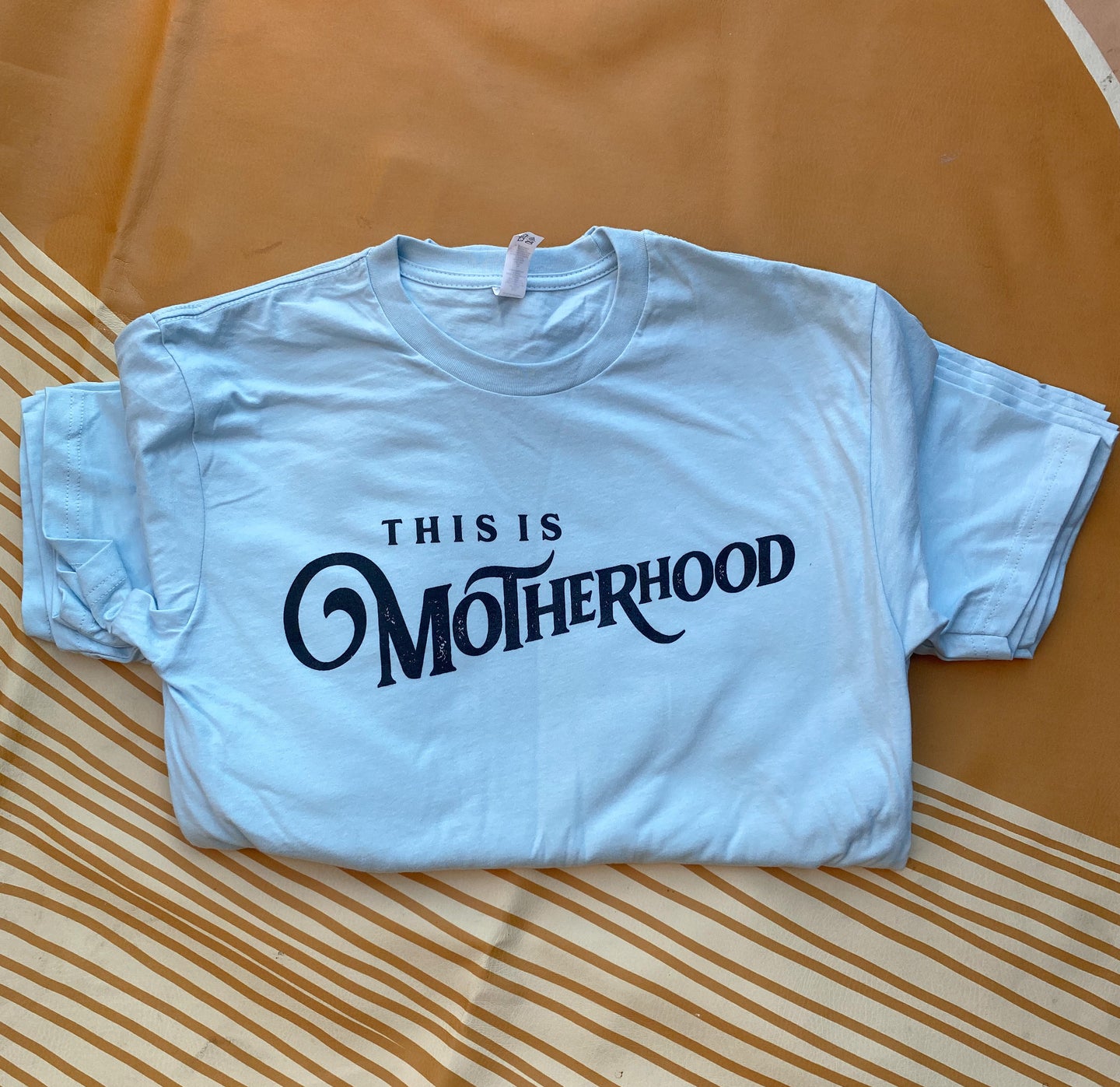 This is Motherhood - Baby Blue - Unisex Short Sleeve Tee [READY TO SHIP]
